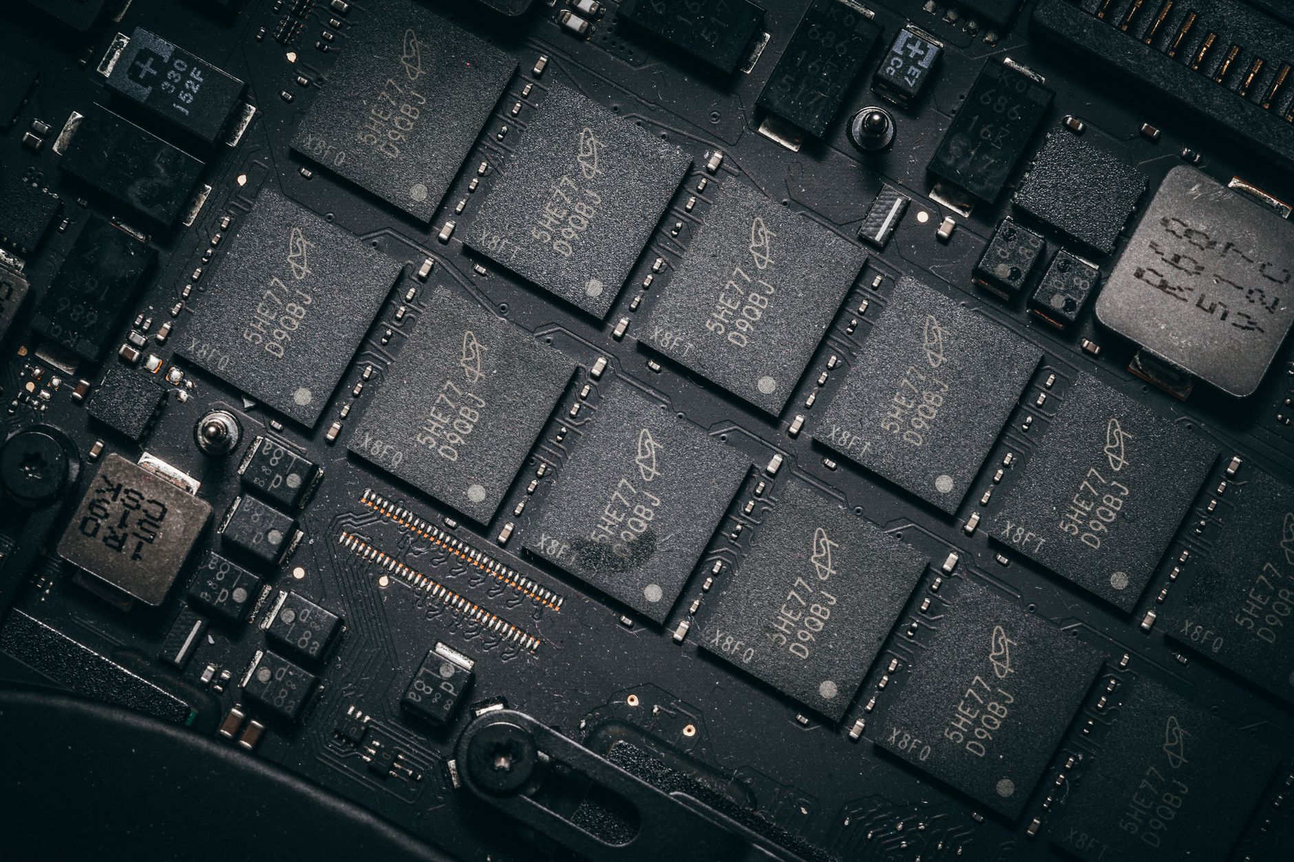 rows of AI semiconductor wafers laid out on a cleanroom inspection table in a chip fabrication facility, viewed from above