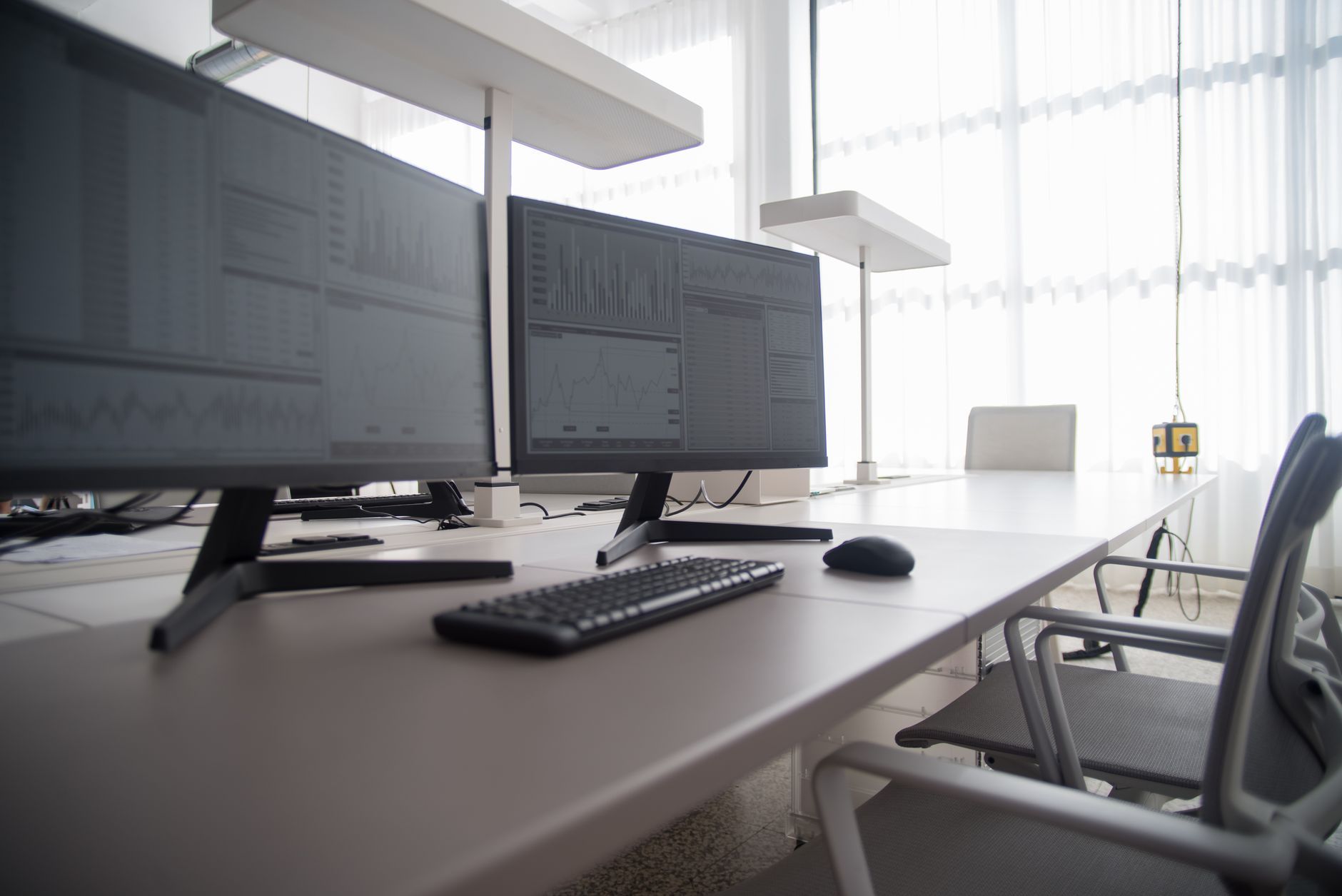 a U.S. Navy base personnel office interior with rows of desks, computers, and administrative equipment in a fluorescent-lit government workspace
