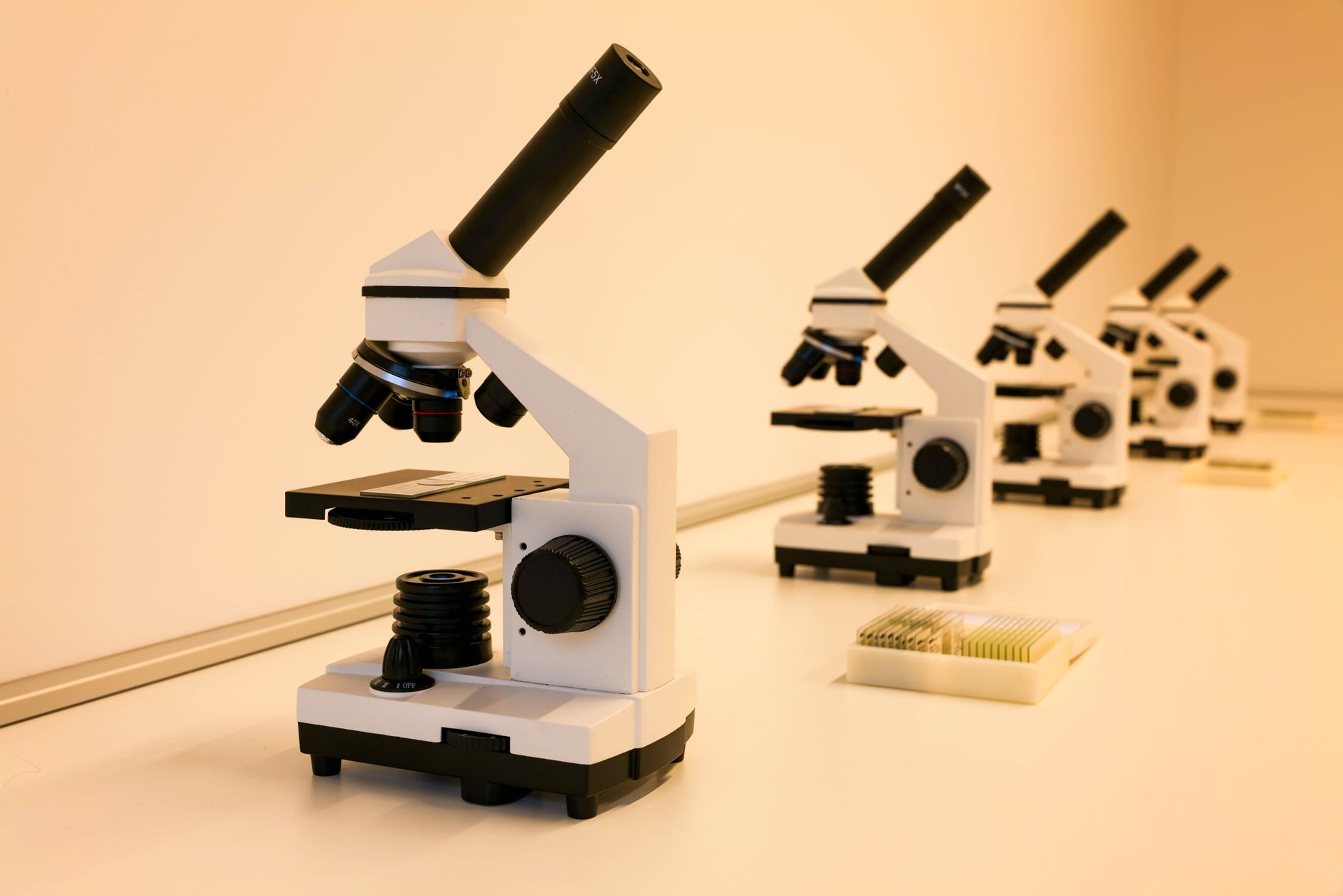 a university quantum research lab interior with optical tables, laser equipment, and fiber optic cabling, no personnel as focal point