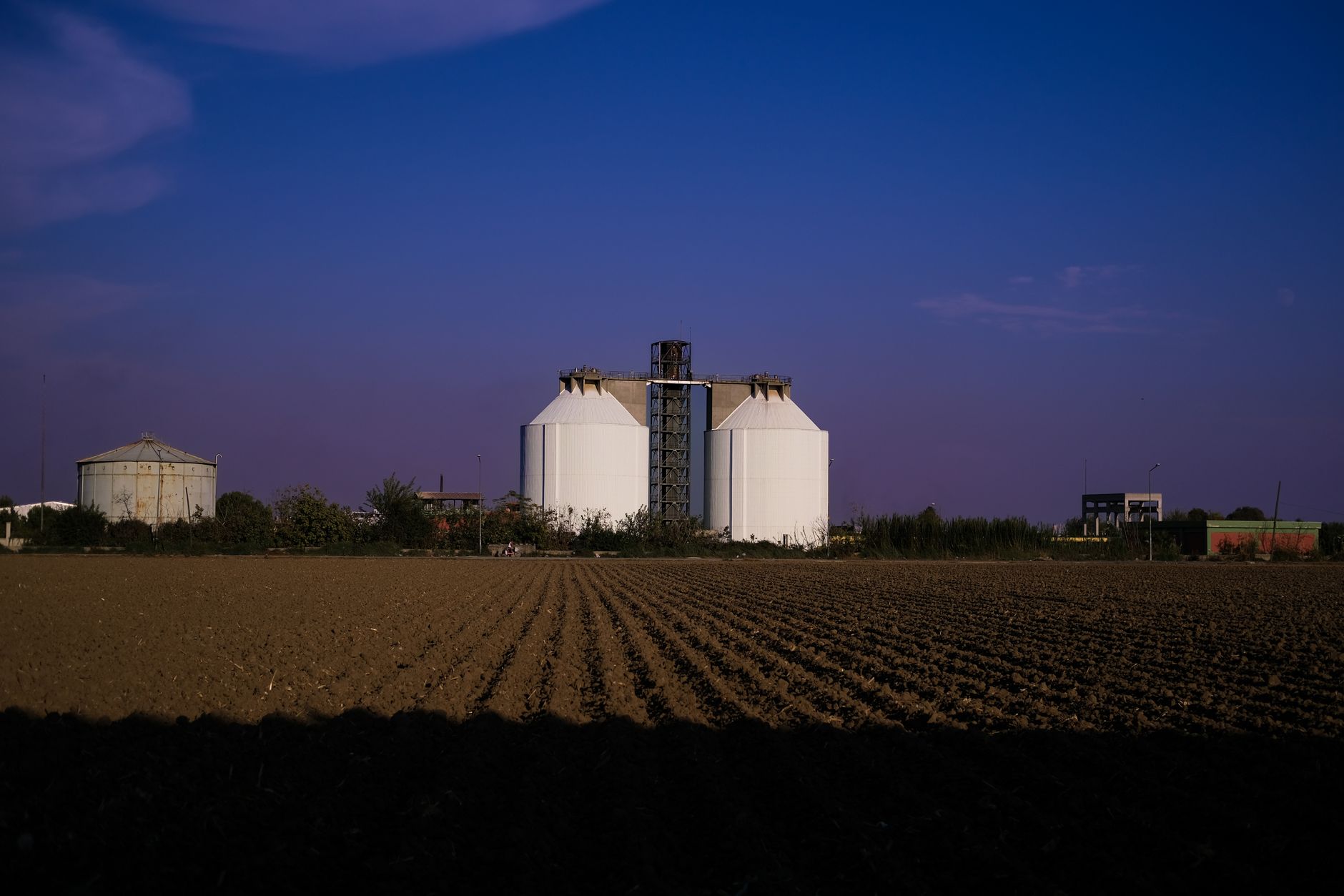 an outdoor Ground-Based Midcourse Defense silo field at a remote US military installation, wide landscape shot, no people as focal point