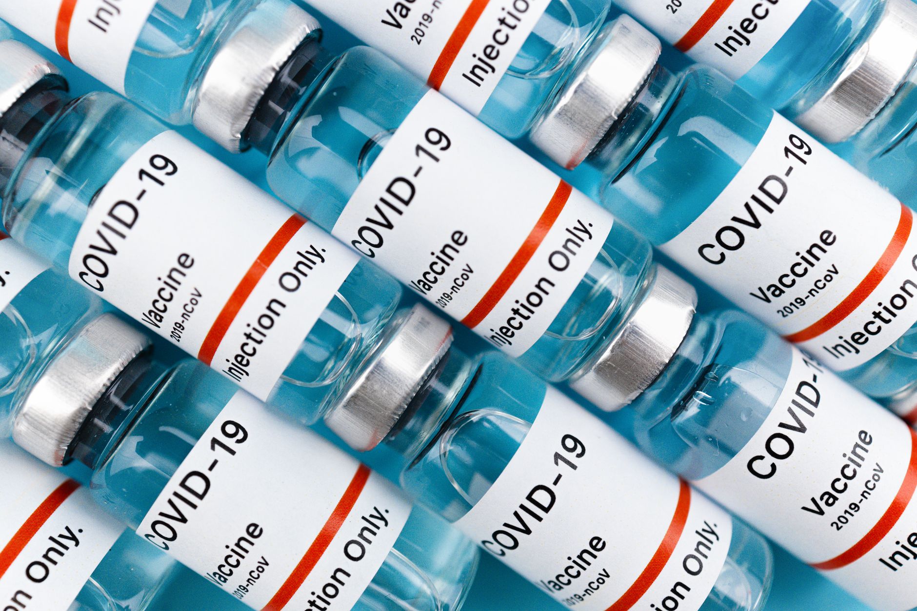 rows of labeled pharmaceutical vials in a controlled clinical trial storage unit inside a federal research laboratory