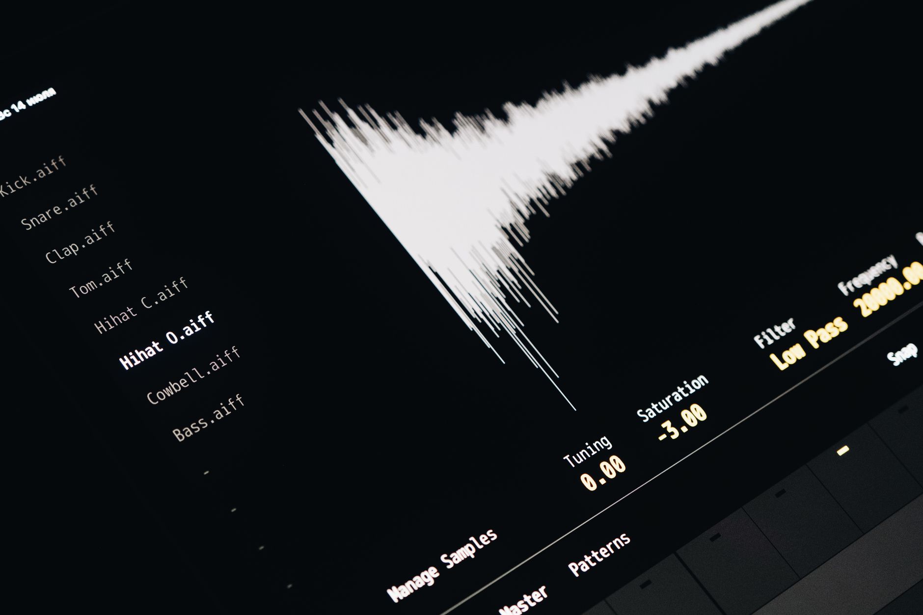 close-up of a tablet device displaying a voice-recognition interface with audio frequency bars, resting on a desk beside a notepad