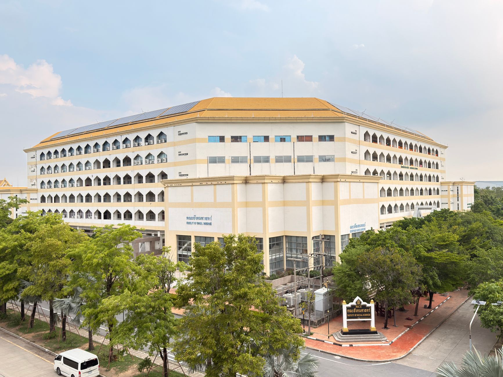 aerial view of a large government reception compound with manicured grounds and formal architecture, late afternoon light, no people visible as focal point